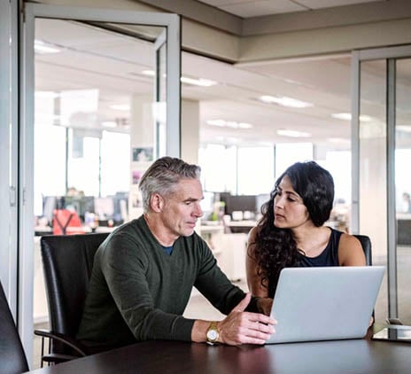 Grant Thornton Australia - man and woman at laptops